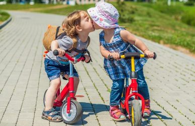 Two kids on balance bike